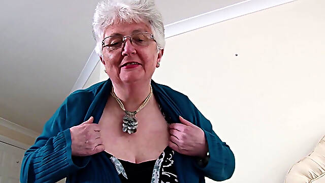 Fat granny Caroline V caresses her pussy