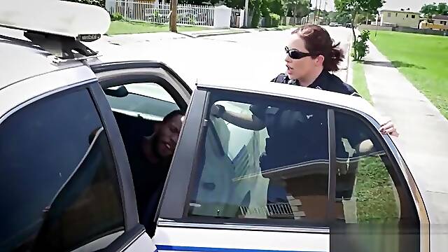 Two cougar police officers sharing fat black cock outdoors