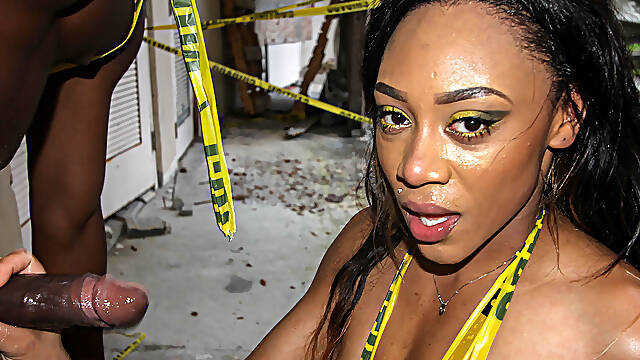 Thick ebony drops low and takes fat black cock outside