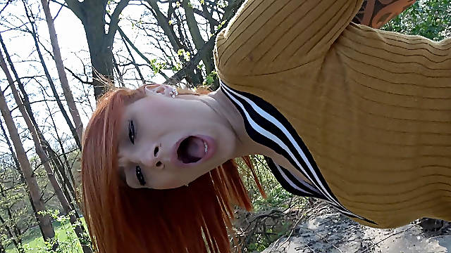 Smoking hot redhead rides big fat dong in the woods