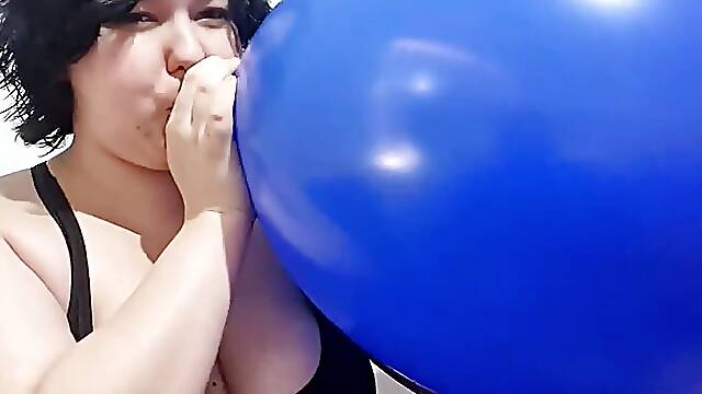 Blowing up HUGE blue balloon