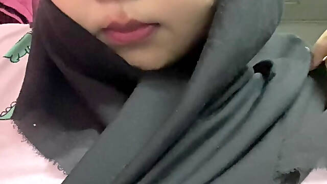 Hijabi malay sucking dildo