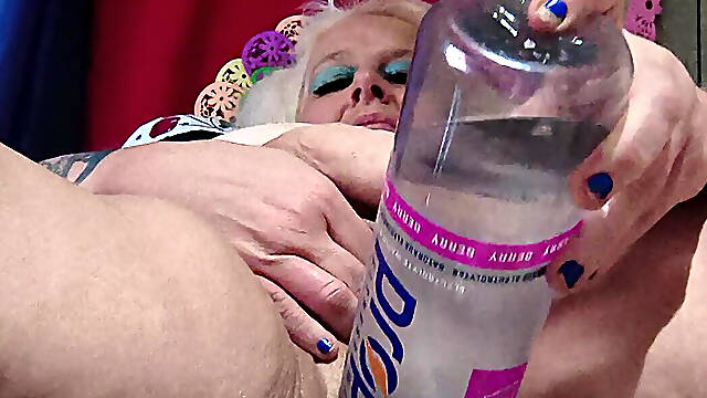 Big Bottle Plugged Clit Cunt