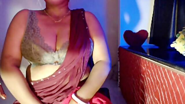 Busty Indian Bhabhi enjoys solo play with her huge boobs getting pinched