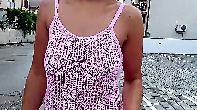 A public walk around the city without underwear in a translucent dress