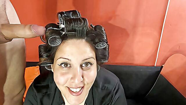 Naughty slut puts hair rollers and gives a blowjob