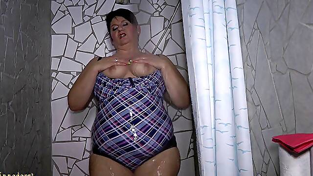 In swimsuit under the shower