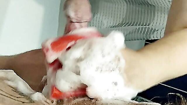 Fingering my cock with a soapy sponge