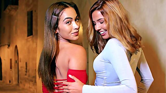 Two sexy brunettes share a big cock in an intense threesome session